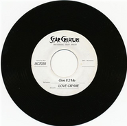 Love Cryme, Give It 2 Me / She's So Freaky (7")